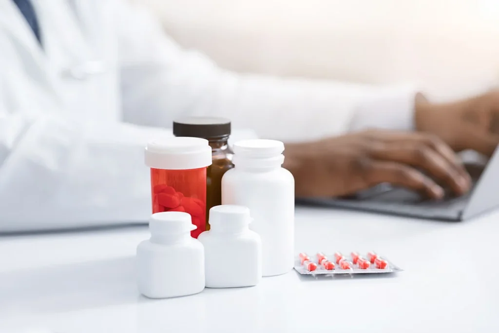 healthcare professional working at desk with medic