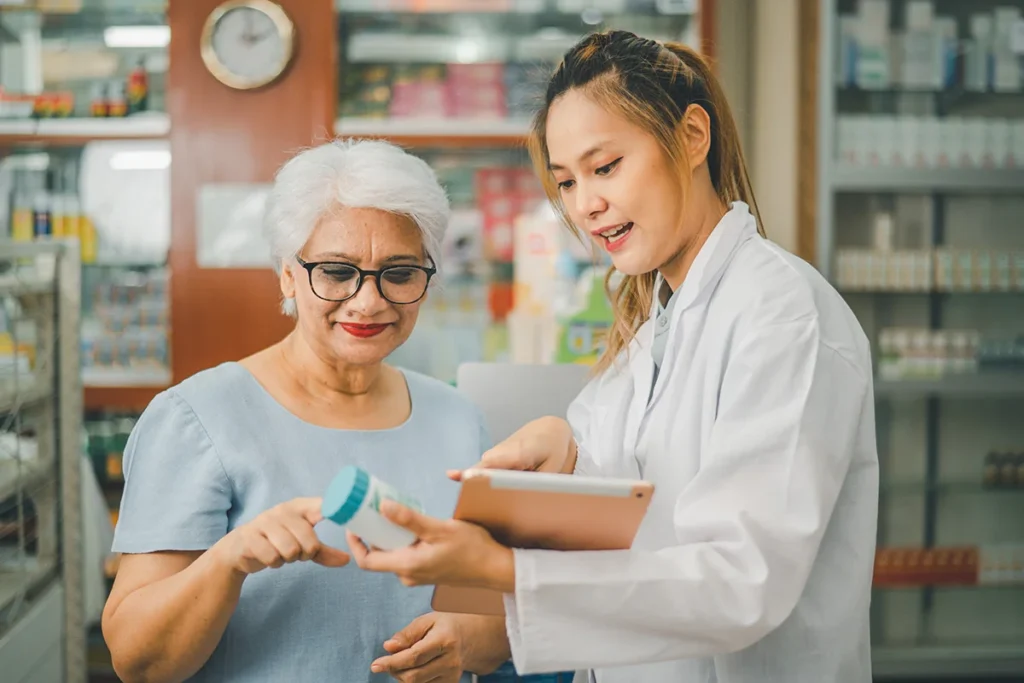woman discussing medication with pharmacist