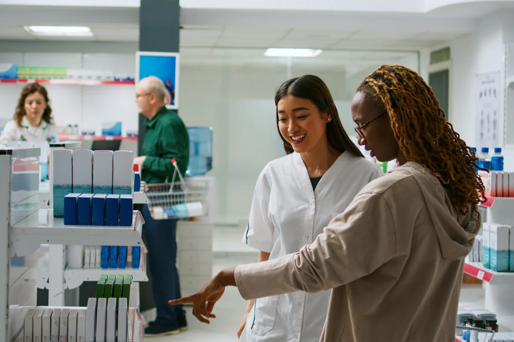 pharmacist assisting customer with medication