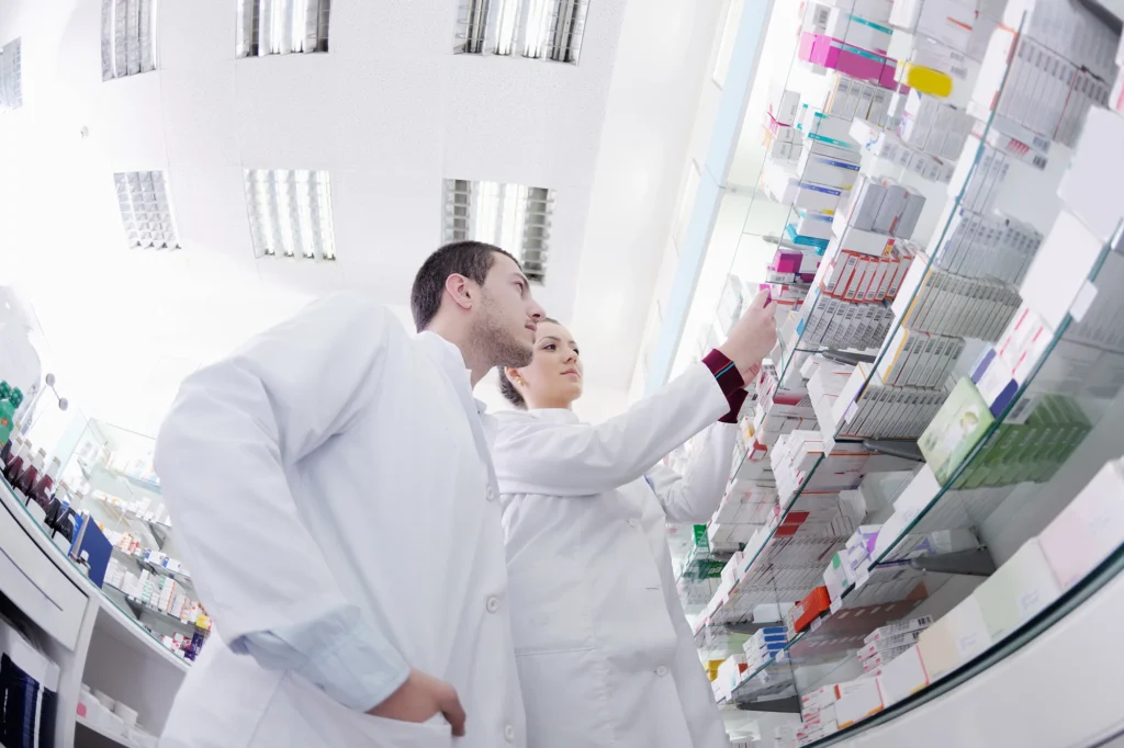 team of pharmacist chemist woman and man group