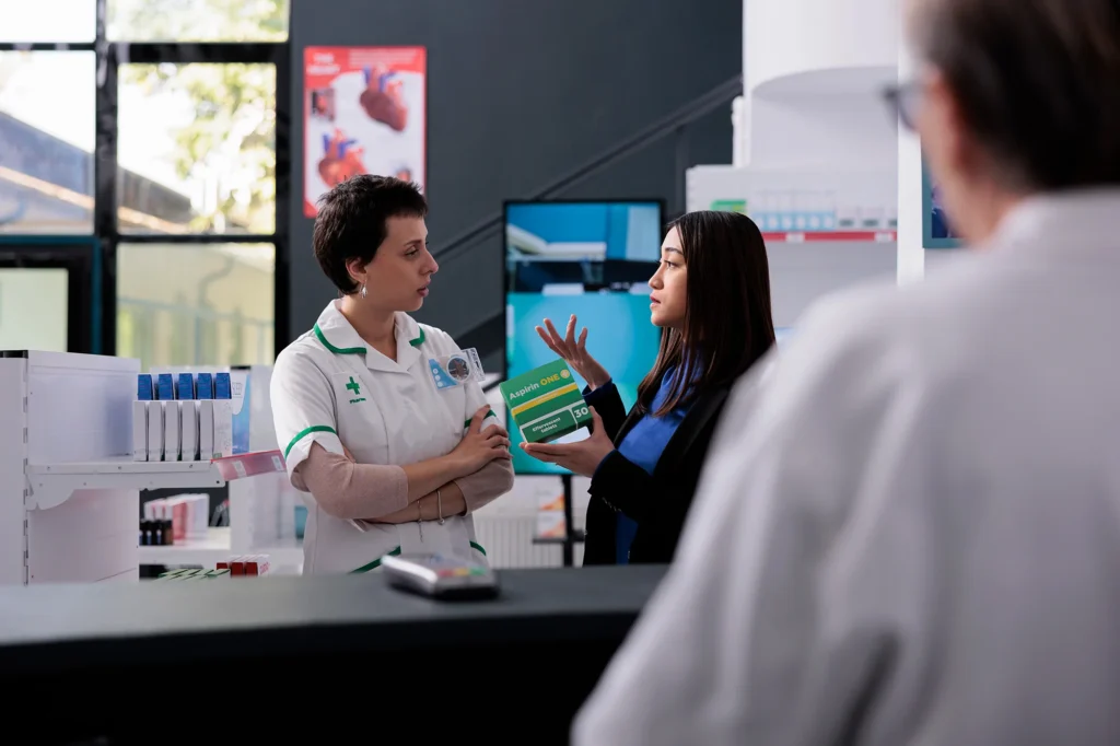 woman talking to pharmacist about medication